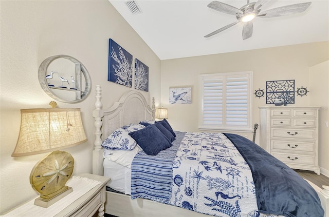 bedroom with wood-type flooring and ceiling fan