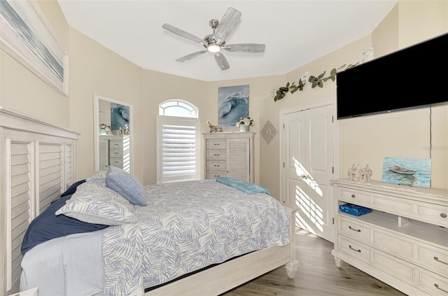 bedroom with ceiling fan and light wood-type flooring