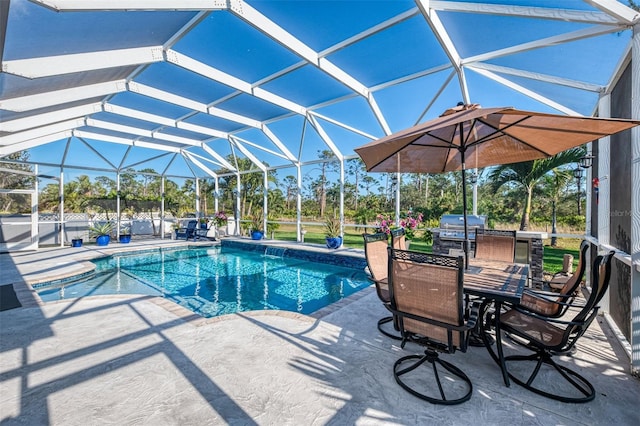 view of swimming pool with a lanai and a patio