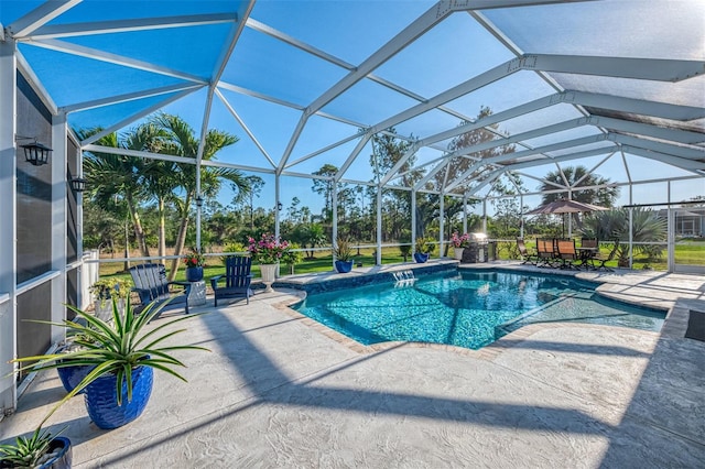 view of swimming pool featuring a lanai and a patio