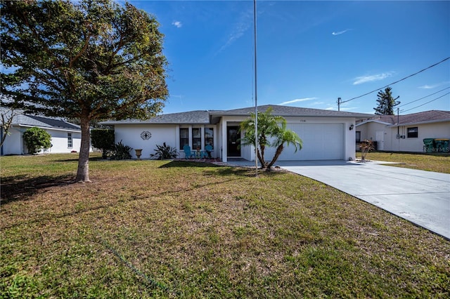 ranch-style house with a garage and a front lawn