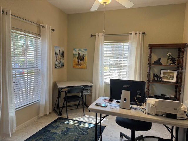 office space featuring light tile patterned flooring and ceiling fan