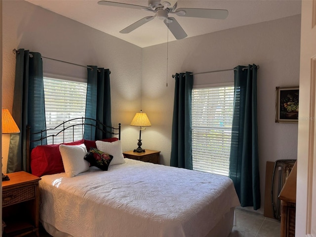 bedroom with light tile patterned floors and ceiling fan