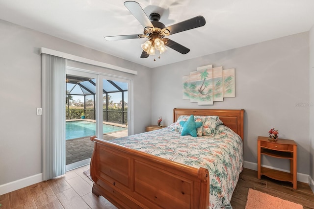 bedroom featuring hardwood / wood-style flooring, access to outside, and ceiling fan