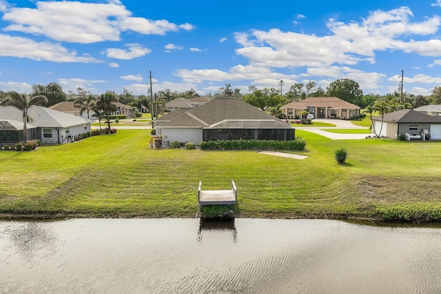 surrounding community featuring a water view and a yard