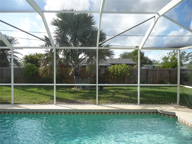 view of pool featuring a patio, a lanai, and a yard