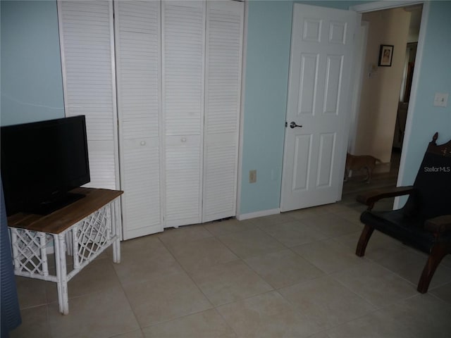 living area with light tile patterned floors