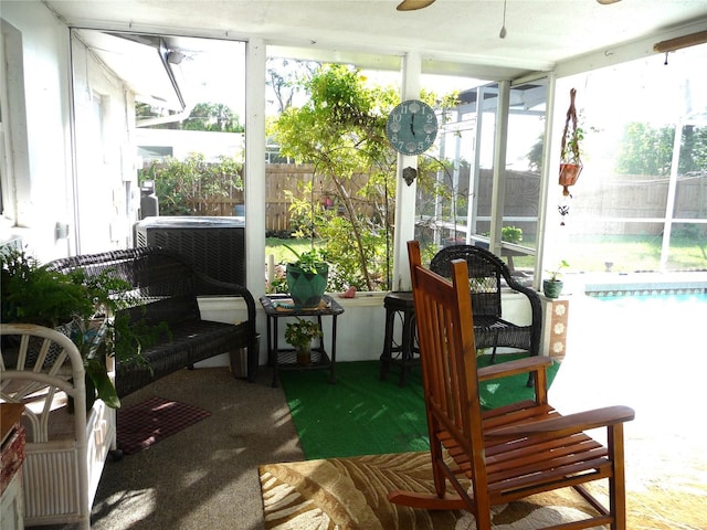 sunroom / solarium with ceiling fan