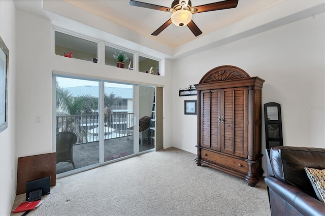 sitting room with carpet floors and ceiling fan