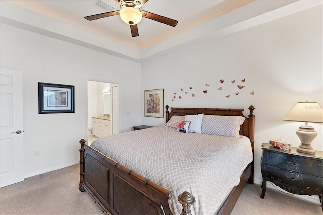 carpeted bedroom with ceiling fan and ensuite bathroom