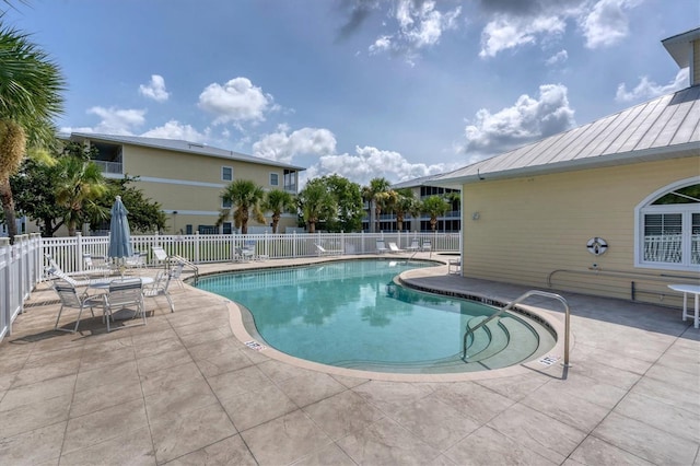 view of swimming pool featuring a patio area