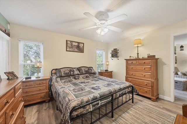 bedroom featuring ceiling fan and light wood-type flooring