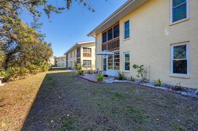 view of home's exterior with a lawn