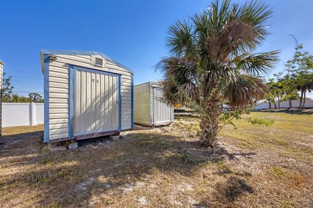 view of outbuilding with a yard