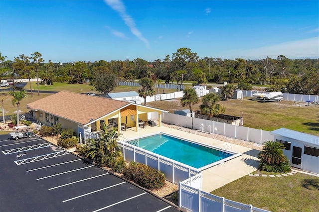 view of pool with a yard and a patio area