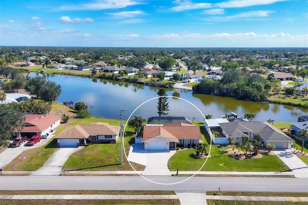 birds eye view of property with a water view