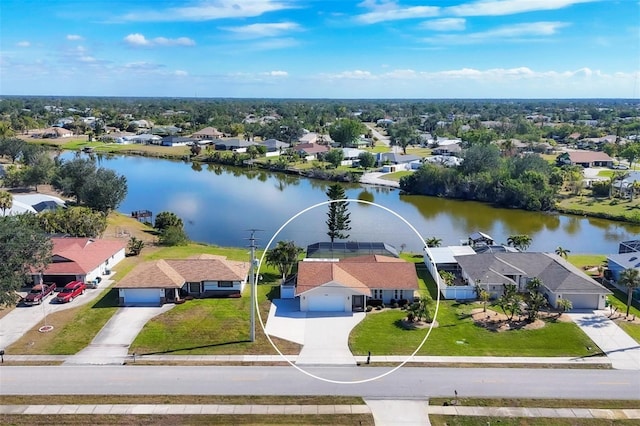 birds eye view of property with a water view