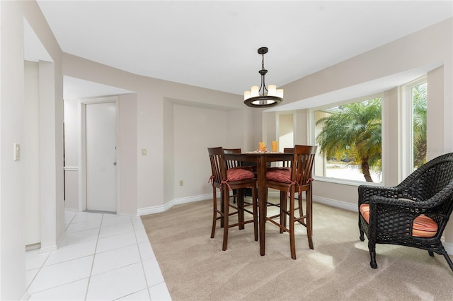 tiled dining area featuring a notable chandelier