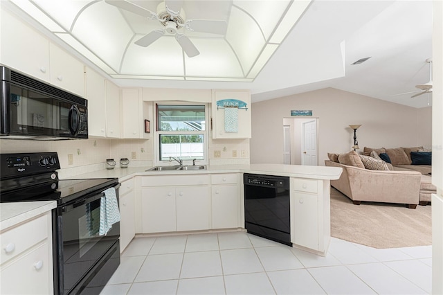 kitchen featuring sink, ceiling fan, white cabinetry, black appliances, and light carpet