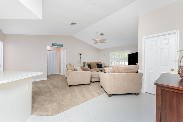 carpeted living room with ceiling fan and lofted ceiling