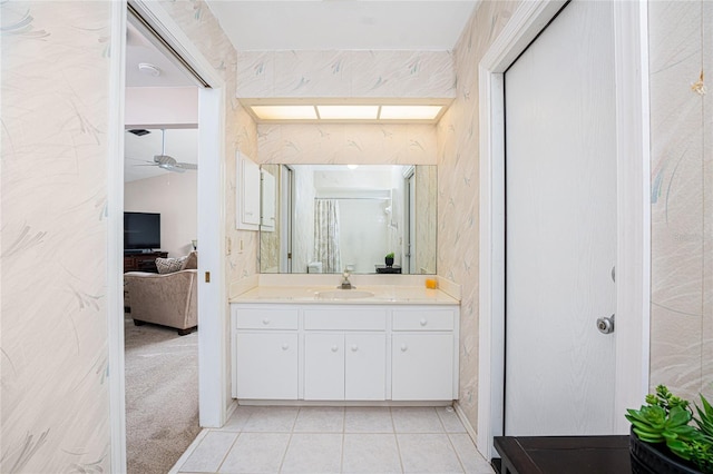 bathroom with ceiling fan, vanity, and tile patterned flooring