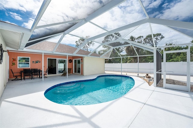 view of swimming pool with a patio and a lanai