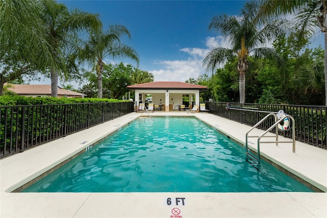 view of swimming pool featuring a patio area