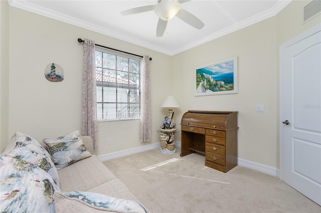 carpeted home office with ceiling fan and ornamental molding