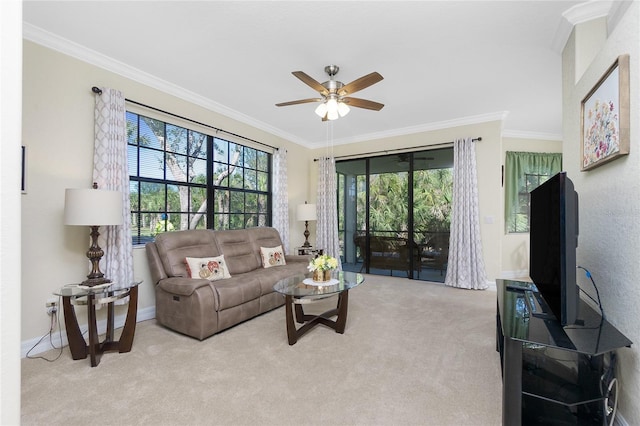 carpeted living room with crown molding and ceiling fan