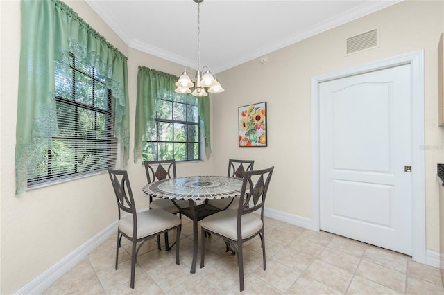 tiled dining space featuring crown molding and a chandelier