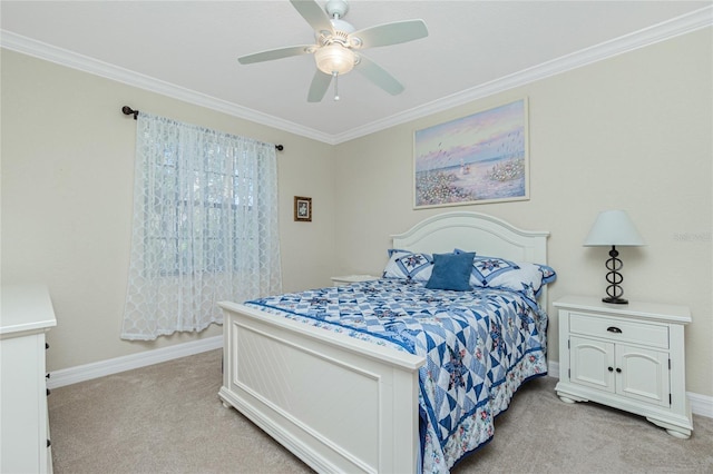 carpeted bedroom featuring crown molding and ceiling fan