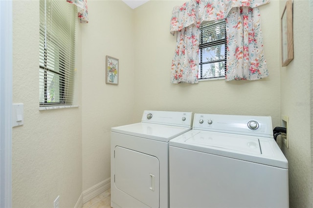 laundry area with separate washer and dryer