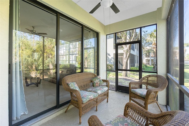 sunroom featuring ceiling fan