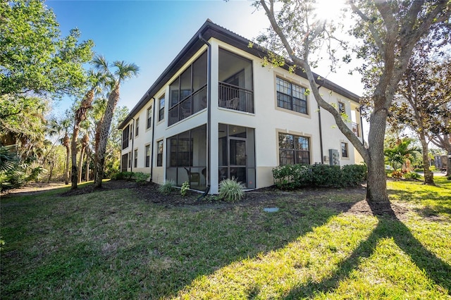 view of property exterior featuring a lawn