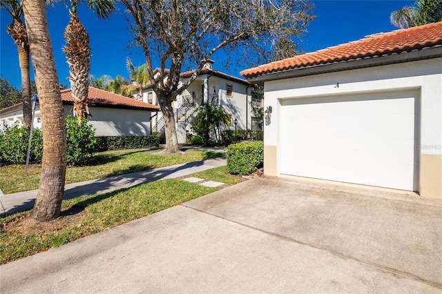 mediterranean / spanish-style home with a garage