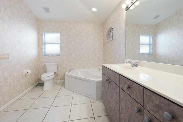 bathroom featuring tile patterned floors, toilet, visible vents, and a wealth of natural light