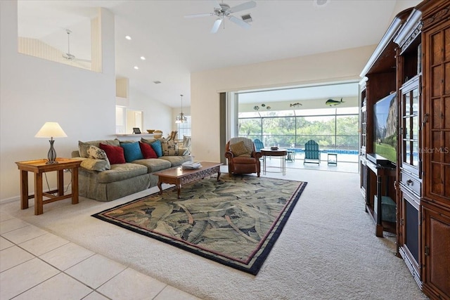 living room with high vaulted ceiling, light colored carpet, a sunroom, and ceiling fan