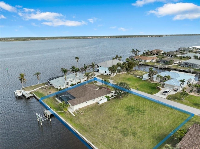 bird's eye view with a residential view and a water view