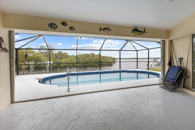 pool with a patio and a lanai