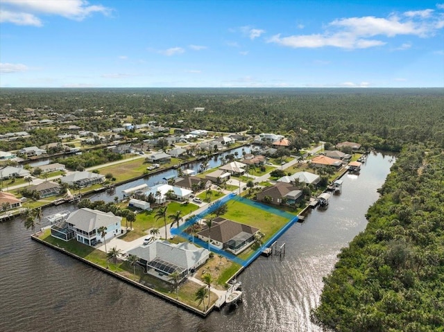 birds eye view of property featuring a residential view and a water view