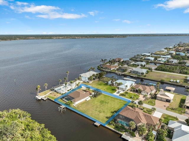 aerial view featuring a residential view and a water view