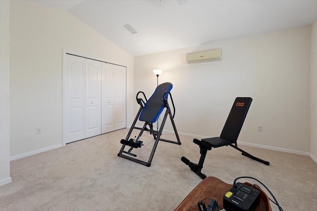 exercise room featuring a wall mounted air conditioner, baseboards, carpet, and vaulted ceiling