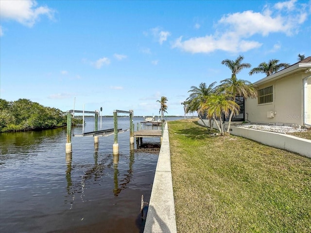 view of dock featuring glass enclosure, a water view, boat lift, and a lawn