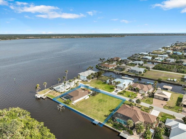 bird's eye view with a residential view and a water view