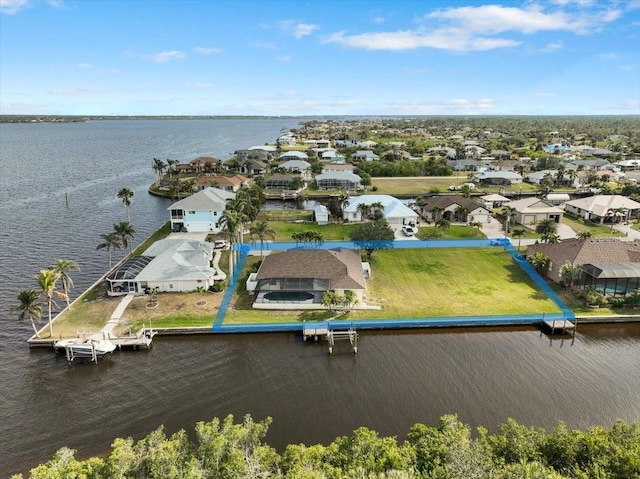 aerial view with a residential view and a water view