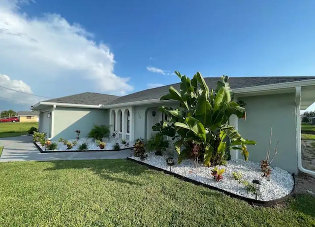 view of home's exterior featuring a lawn