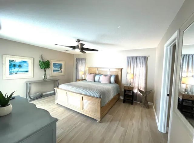 bedroom featuring ceiling fan and light hardwood / wood-style flooring