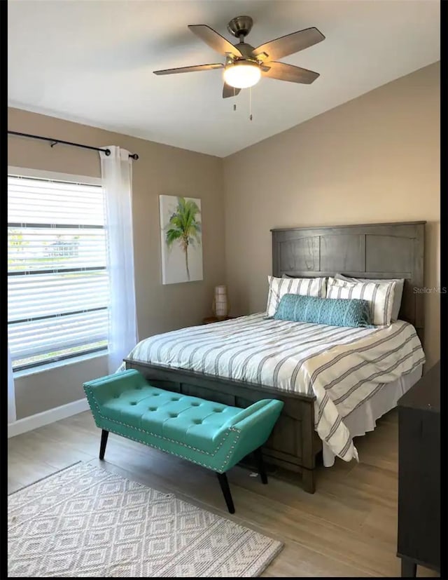 bedroom featuring ceiling fan and light hardwood / wood-style floors