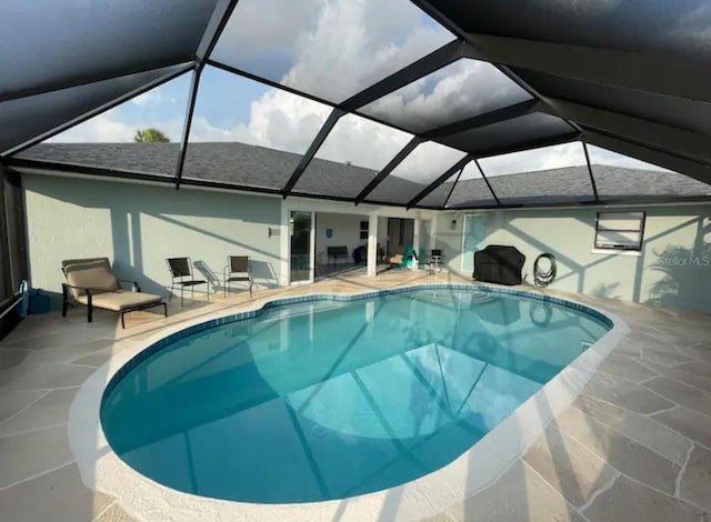 view of pool featuring a lanai and a patio area