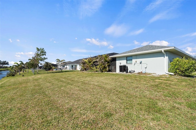 rear view of house featuring a yard